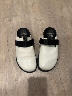 Sorel White Leather Slip-On Clogs with Black Strap Detail